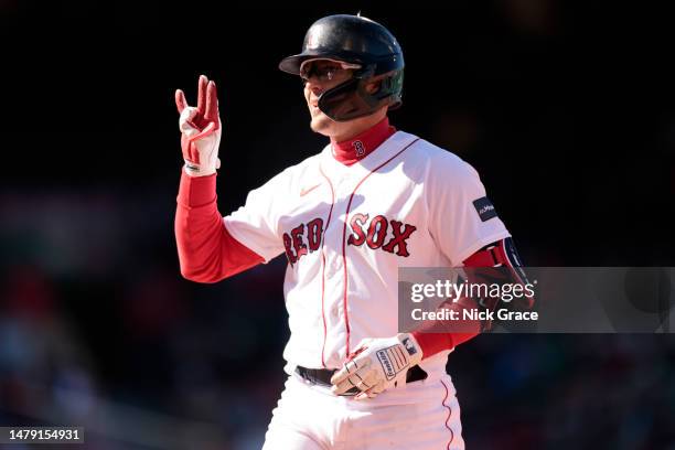 Enrique Hernandez of the Boston Red Sox reacts after hitting an RBI single during the seventh inning against the Baltimore Orioles at Fenway Park on...