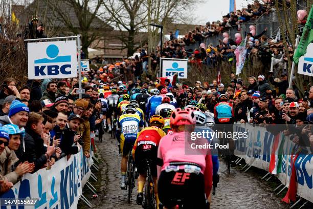 General view of the peloton competing compete while fans cheers during the 107th Ronde van Vlaanderen - Tour des Flandres 2023, Men's Elite a 273.4km...