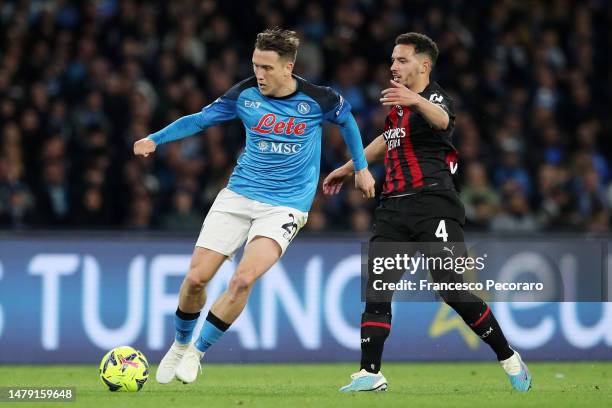 Piotr Zielinski of SSC Napoli battles for possession with Ismael Bennacer of AC Milan during the Serie A match between SSC Napoli and AC Milan at...