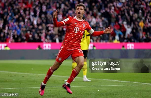 Thomas Mueller of Muenchen celebrates after scoring his teams third goal during the Bundesliga match between FC Bayern München and Borussia Dortmund...