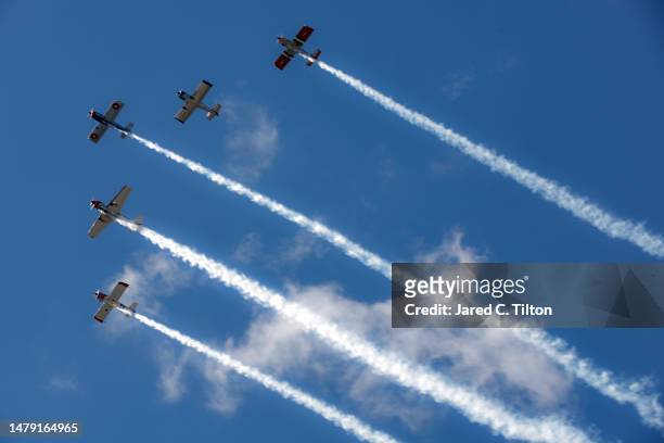 The Bandits Flight Team performs a flyover during pre-race ceremonies prior to the NASCAR Cup Series Toyota Owners 400 at Richmond Raceway on April...