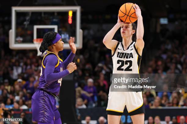 Caitlin Clark of the Iowa Hawkeyes with the ball against Alexis Morris of the LSU Lady Tigers during the third quarter during the 2023 NCAA Women's...