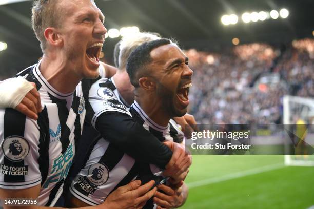 Newcastle striker Callum Wilson celebrates with team mates after scoring the second Newcastle goal during the Premier League match between Newcastle...