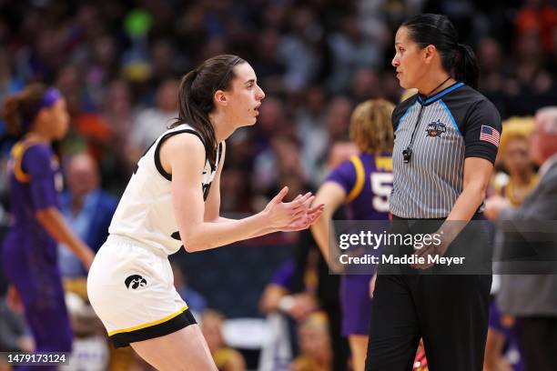 Caitlin Clark of the Iowa Hawkeyes reacts during the third quarter against the LSU Lady Tigers during the 2023 NCAA Women's Basketball Tournament...