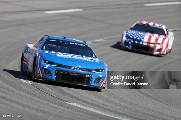 Kyle Larson, driver of the HendrickCars.com Chevrolet, and Ross Chastain, driver of the Jockey Chevrolet, race during the NASCAR Cup Series Toyota...