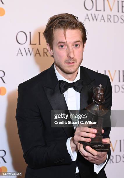Arthur Darvill, winner of the Best Actor in a Musical award for "Rodgers & Hammerstein's Oklahoma!", poses in the winner's room during The Olivier...