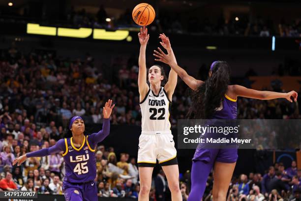 Caitlin Clark of the Iowa Hawkeyes shoots the ball against Angel Reese of the LSU Lady Tigers during the fourth quarter during the 2023 NCAA Women's...