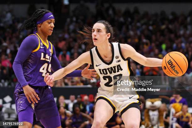 Alexis Morris of the LSU Lady Tigers defends against Caitlin Clark of the Iowa Hawkeyes during the fourth quarter during the 2023 NCAA Women's...
