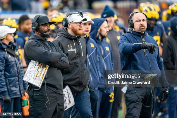 Defensive Coordinator Steve Clinkscale, Special Teams Coordinator Jay Harbaugh and Linebackers Coach Chris Partridge look on during the fourth...