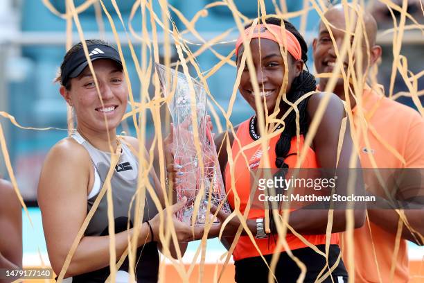 Coco Gauff and Jessica Pegula of United States celebrate with the trophy after defeating Leylah Fernandez of Canada and Taylor Townsend of United...