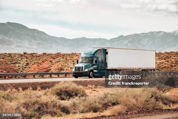 truck driving in the southwest - articulated lorry stock pictures, royalty-free photos & images