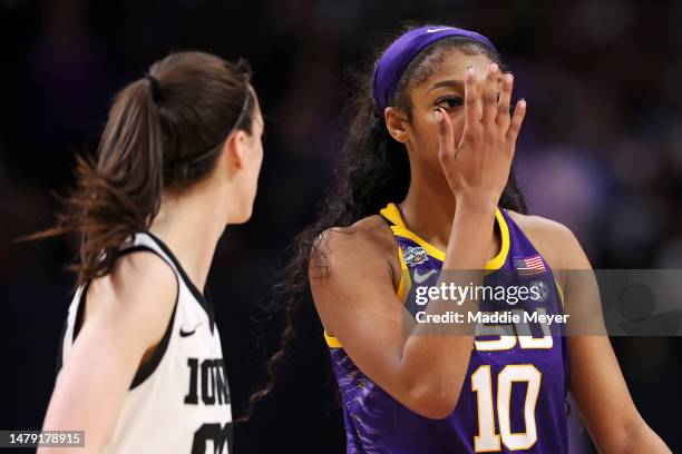 Angel Reese of the LSU Lady Tigers reacts towards Caitlin Clark of the Iowa Hawkeyes during the fourth quarter during the 2023 NCAA Women's...