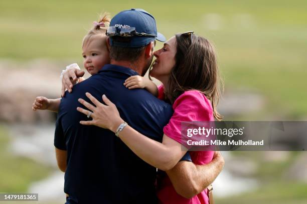 Corey Conners of Canada celebrates with wife Malory and daughter Reis after winning the Valero Texas Open at TPC San Antonio on April 02, 2023 in San...