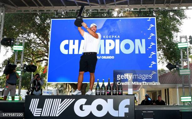 Captain Brooks Koepka of Smash GC celebrates with the trophy after winning the LIV Golf Invitational - Orlando at The Orange County National on April...
