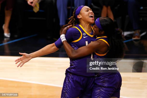 LaDazhia Williams and Flau'jae Johnson of the LSU Lady Tigers react during the fourth quarter against the Iowa Hawkeyes during the 2023 NCAA Women's...