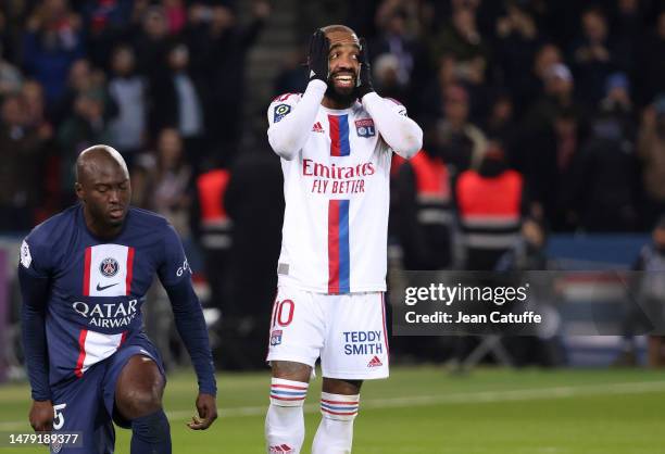 Alexandre Lacazette of Lyon reacts after missing his penalty kick during the Ligue 1 Uber Eats match between Paris Saint-Germain and Olympique...