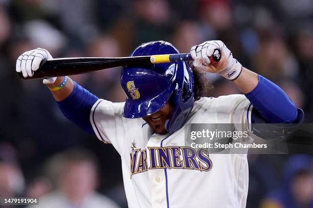 Eugenio Suarez of the Seattle Mariners reacts after striking out during the tenth inning against the Cleveland Guardians at T-Mobile Park on April...