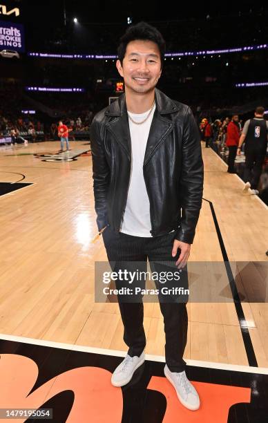 Actor Simu Liu attends the game between the Dallas Mavericks and the Atlanta Hawks at State Farm Arena on April 02, 2023 in Atlanta, Georgia.