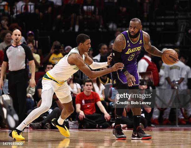 LeBron James of the Los Angeles Lakers backs in on Jabari Smith Jr. #1 of the Houston Rockets during the first quarter at Toyota Center on April 02,...