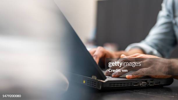 man hands typing on laptop keyboard - tangentbord bildbanksfoton och bilder