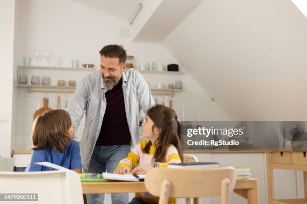 father homeschooling his adopted children - foster care stock pictures, royalty-free photos & images