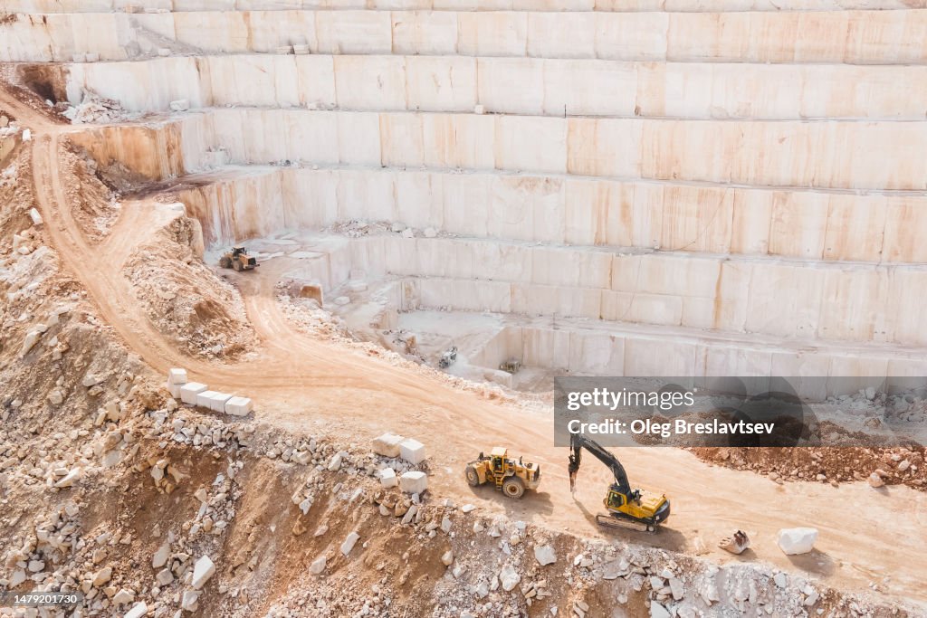 Aerial drone view of huge marble quarry. Open pit stone mining