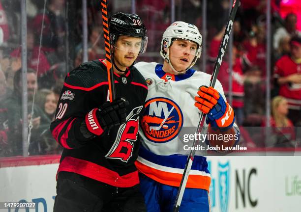 Sebastian Aho of the Carolina Hurricanes and Sebastian Aho of the New York Islanders skate during the third period of a game at PNC Arena on April...