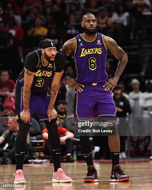 LeBron James and Anthony Davis of the Los Angeles Lakers look on during a time out against the Houston Rockets during the fourth quarter at Toyota...