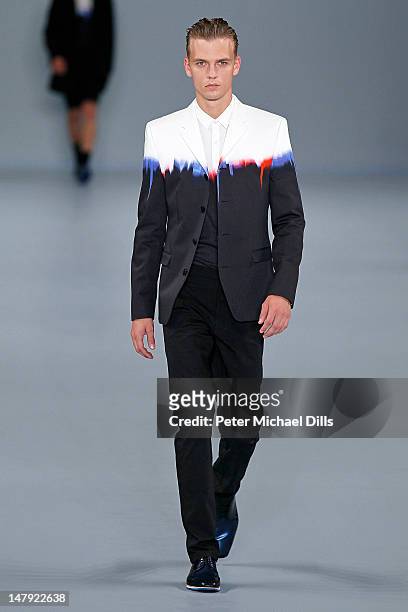 Model walks the runway at the Hugo by Hugo Boss fashion show on July 5, 2012 in Berlin, Germany.