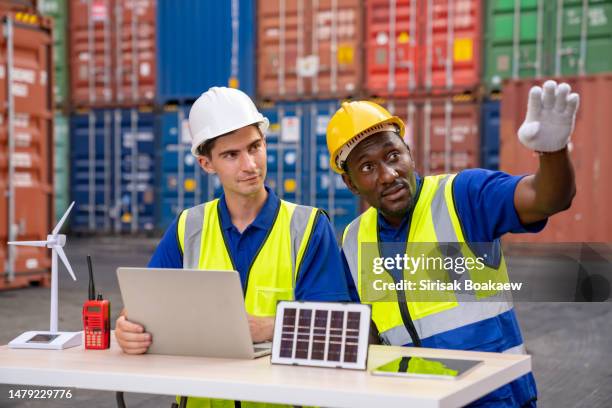 portrait of caucasian man worker working in container port terminal. - marine engineering stock pictures, royalty-free photos & images