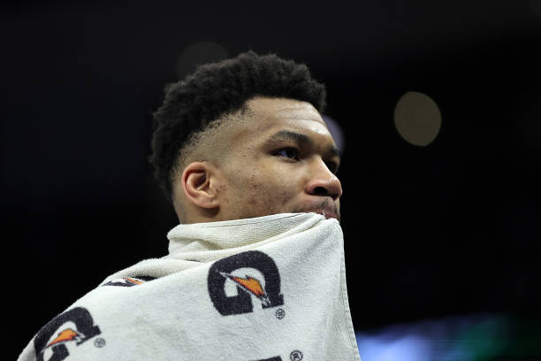 Giannis Antetokounmpo of the Milwaukee Bucks stands on the sideline during the second half of a game against the Philadelphia 76ers at Fiserv Forum...