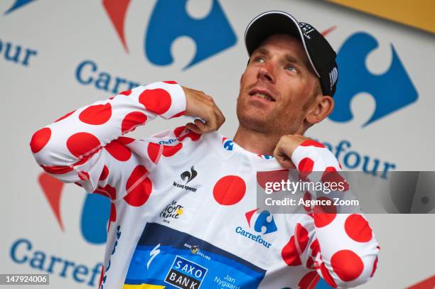 Michael Morkov of Denmark riding for Team Saxo Bank-Tinkoff Bank takes the podium after he retiained the king of the mountains polka dot jersey...