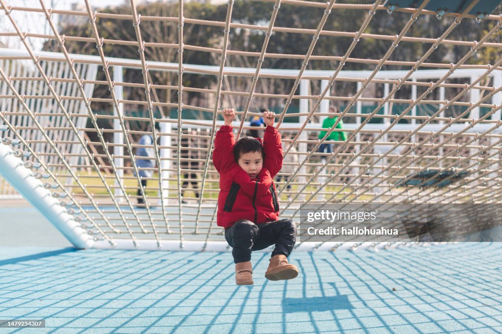 Child Rope Top Little Asian Boy Climbing Rope Frame High-Res Stock Photo - Getty Images