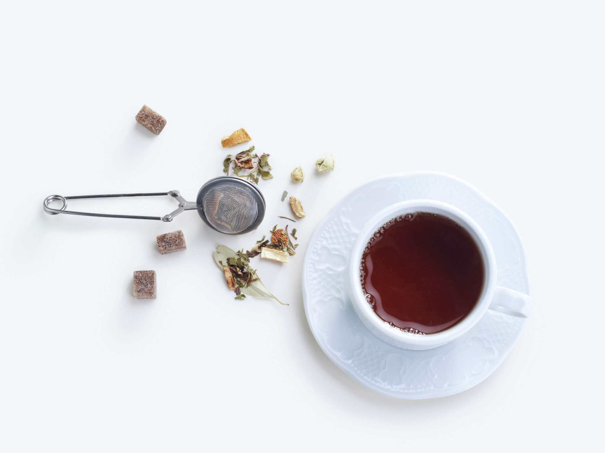 A cup of herbal tea top view. on a white background A cup of herbal tea top view. on a white background