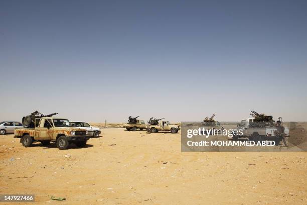 Armed Libyans, who claim to be federalist supporters, set up a checkpoint outside Sidra oil terminal, near Ras Lanuf, after they forced the terminal...