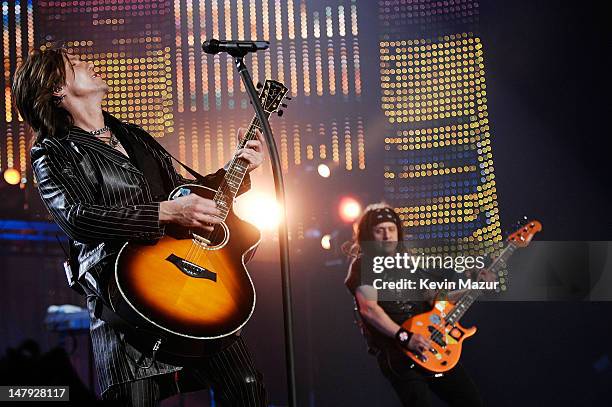 Musicians Johnny Rzeznik and Robby Takac of the Goo Goo Dolls onstage at the Andre Agassi 12th Annual Grand Slam for Children at the MGM Grand Garden...