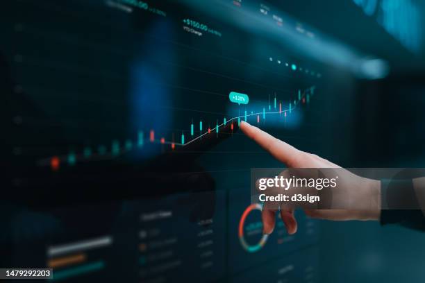 close up of woman's hand touching stock market analysis digital display screen, analyzing investment and financial trading data in candlestick chart on a touch screen interface. business and finance, stock exchange, investment and trading concept - cryptocurrency mining stock pictures, royalty-free photos & images