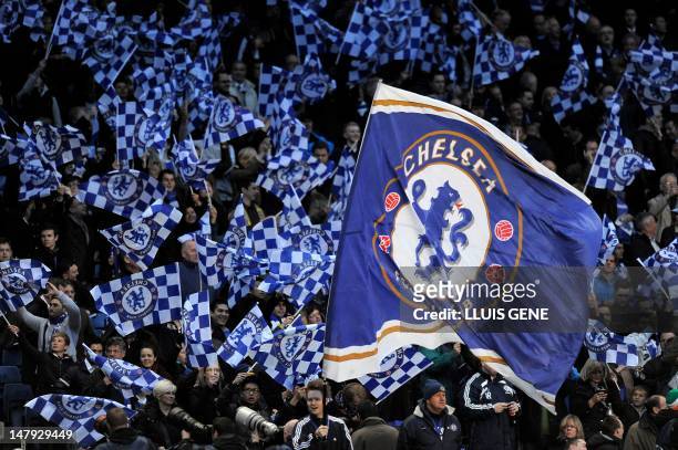 Chelsea fans wave flags ahead of the UEFA Champions League semi-final first leg football match between Chelsea and Barcelona at Stamford Bridge in...