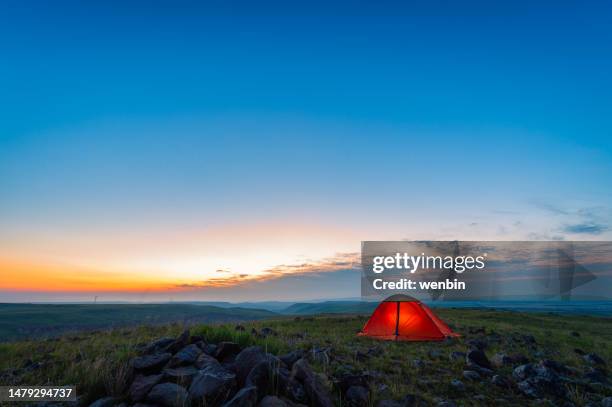 tents in the morning light on the grassland - glen haven co stock pictures, royalty-free photos & images
