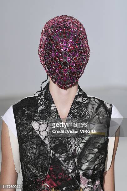 Model walks the runway during the Martin Margiela Haute Couture Fall Winter 2012-2013 show as part of the Paris Haute couture Week on July 4, 2012 in...
