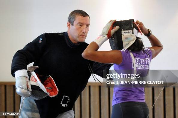 Philippe Riboud French coach Philippe Riboud gives instructions to two-time Olympic ...