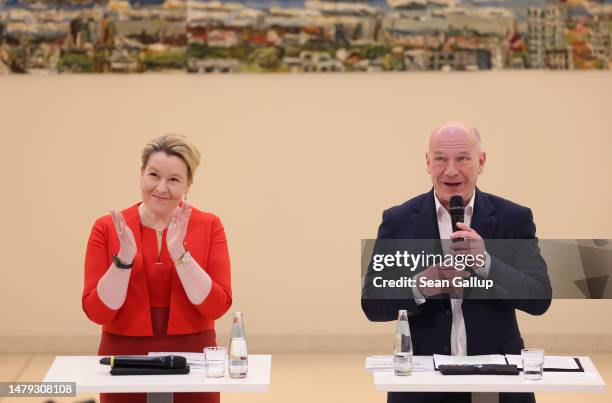 Outgoing Berlin Governing Mayor Franziska Giffey of the German Social Democrats and incoming Mayor Kai Wegner of the German Christian Democrats...