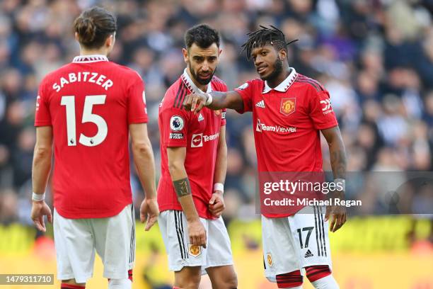 Marcel Sabitze, Bruno Fernandes and Fred of Manchester United speak during the Premier League match between Newcastle United and Manchester United at...