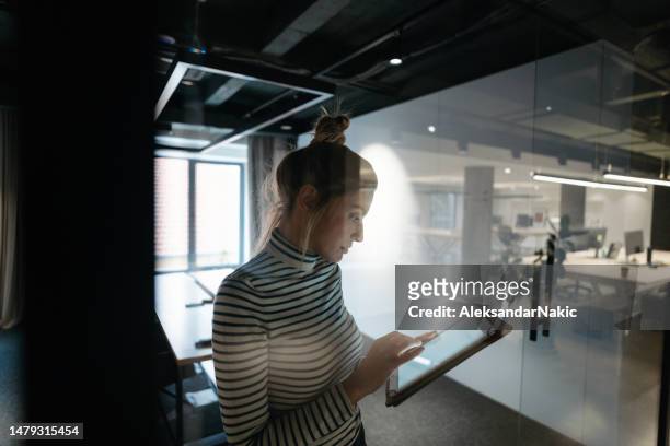young woman using a digital tablet at work - eastern european stock pictures, royalty-free photos & images