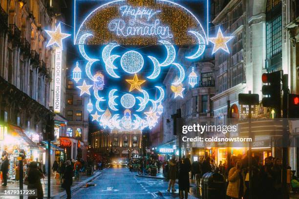 happy ramadan lights and decorations in central london at night - ramadan stock pictures, royalty-free photos & images
