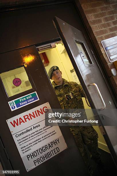 An RAF airmen guards the air tarffic control tower at the Royal International Air Tattoo on July 6, 2012 in Fairford, England. The Royal...