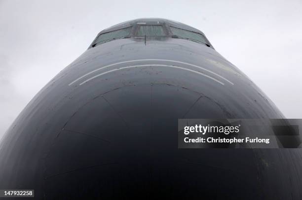 The bulbous nose of a Lockheed C-5B Galaxy belonging to the United States Air Force stands in the rain during the Royal International Air Tattoo on...