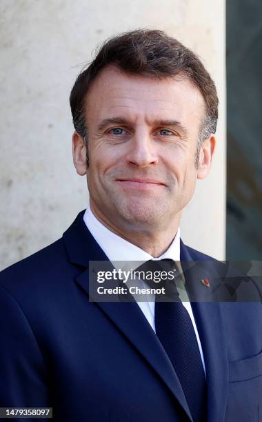 French President Emmanuel Macron smiles as he waits to welcome European Commission President Ursula von der Leyen prior to a working lunch at the...