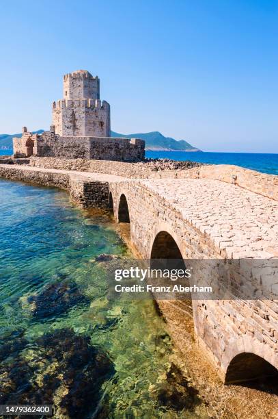 bourtzi tower at the medieval castle of methoni - burg stock-fotos und bilder