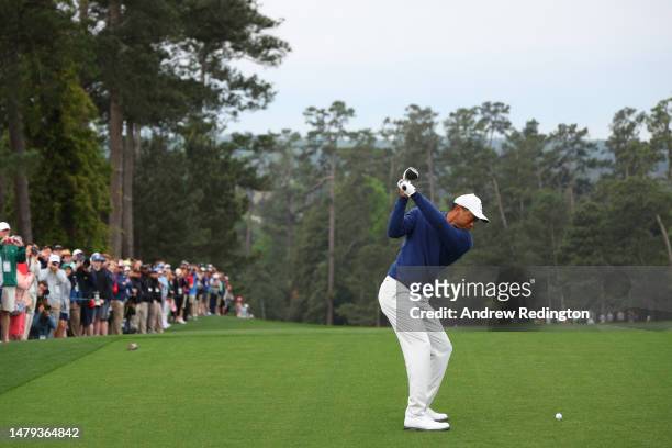 Tiger Woods of the United States plays his shot from the tenth tee during a practice round prior to the 2023 Masters Tournament at Augusta National...